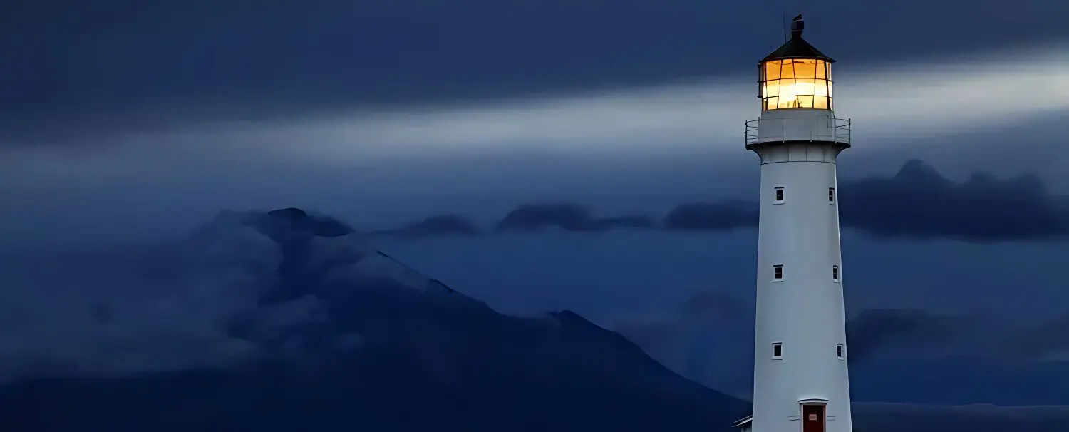 A helicopter flying over the mountains at night.